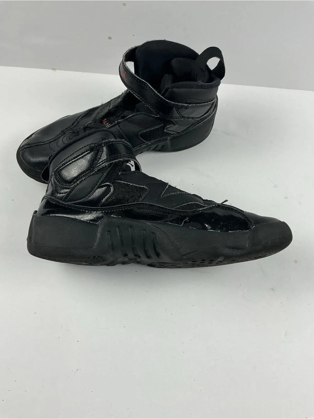 Jordan Black Kids' High-Top Sneakers with Red Jumpman Accents they need inserts